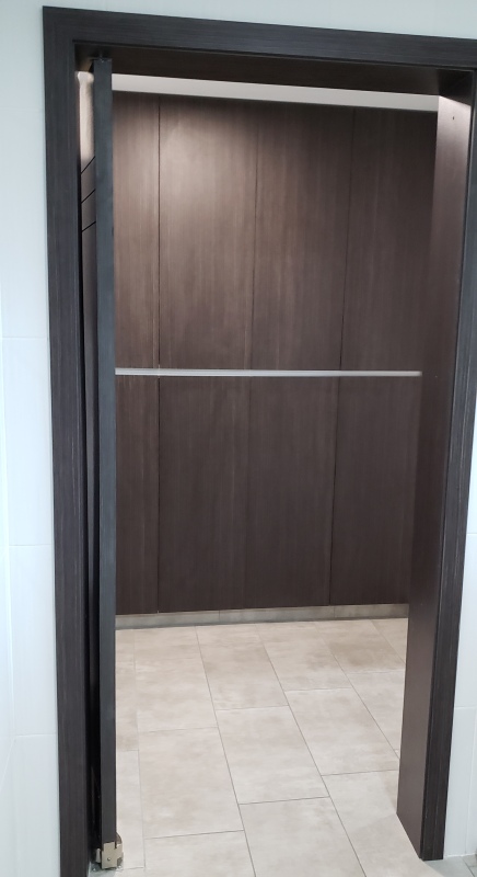 Laundry room swinging door between kitchen and pantry